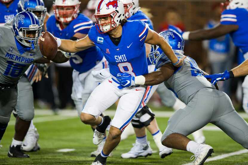 SMU Mustangs quarterback Ben Hicks (8) is tackled by Memphis Tigers linebacker Bryce Huff...
