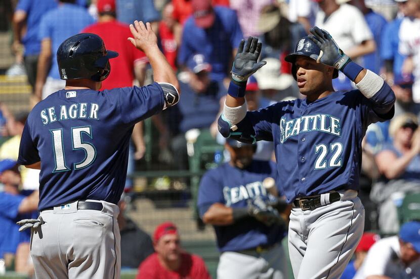 Seattle Mariners second baseman Robinson Cano (22) celebrates his two-run homer with third...