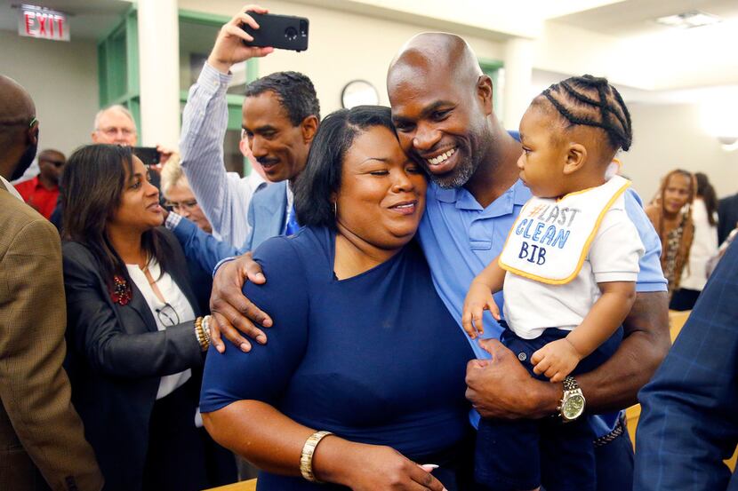After being exonerated in a 1996 murder, exonoree John Nolley Jr (center) gets a hug from...