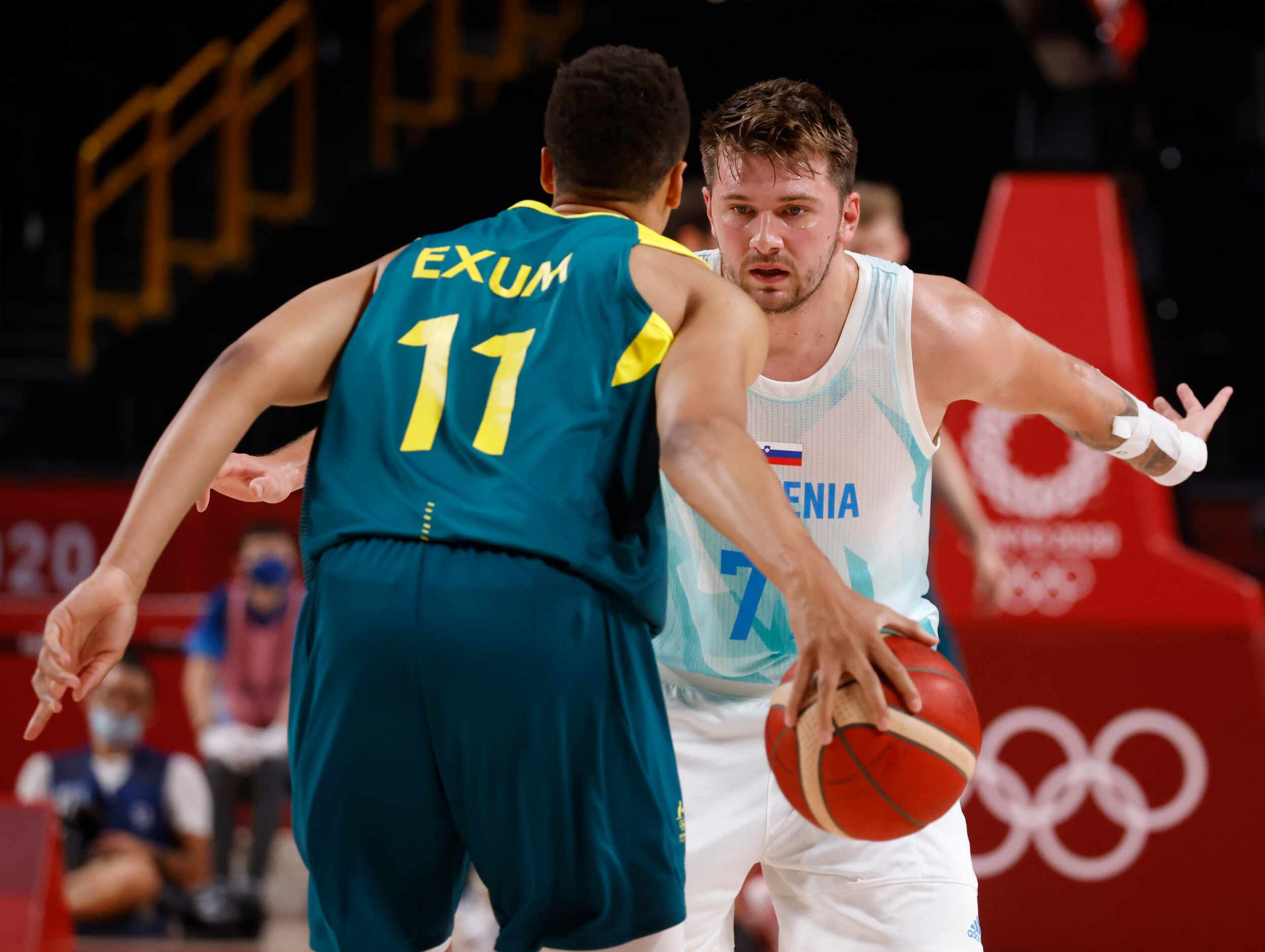 Slovenia’s Luka Doncic (77) looks to defend as Australia’s Dante Exum brings the ball up the...