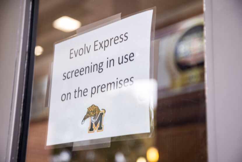 A sign at the entrance states that the Evolv Express weapons detection screening is in use...