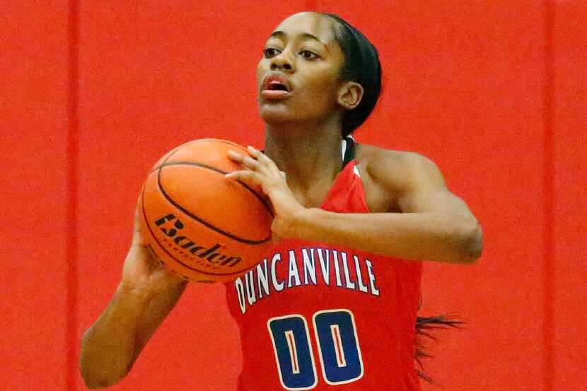 Duncanville guard Zarielle Green starts a fast break with a pass during the first half of...