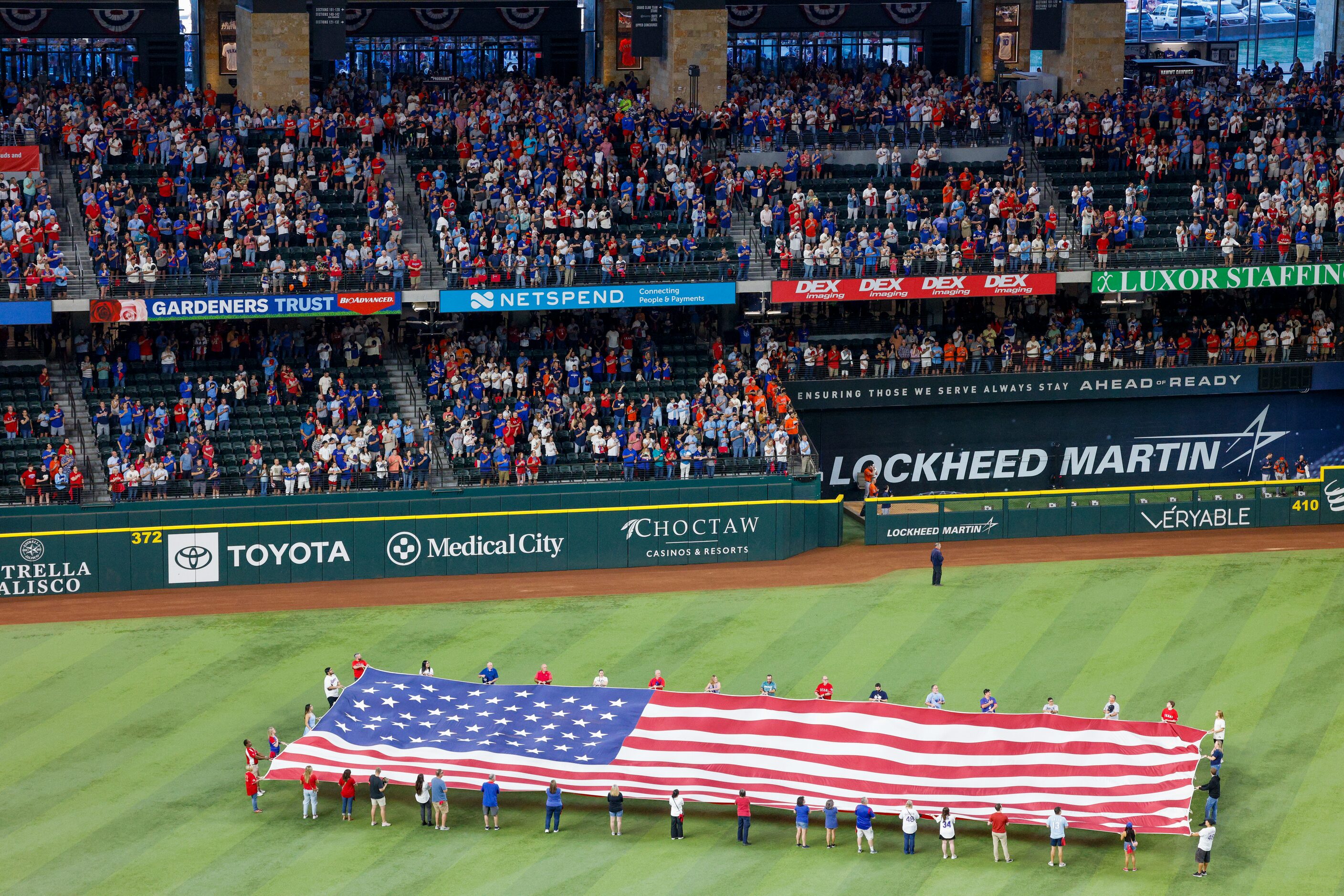 Fans stand for the national anthem before Game 5 of the American League Championship series...