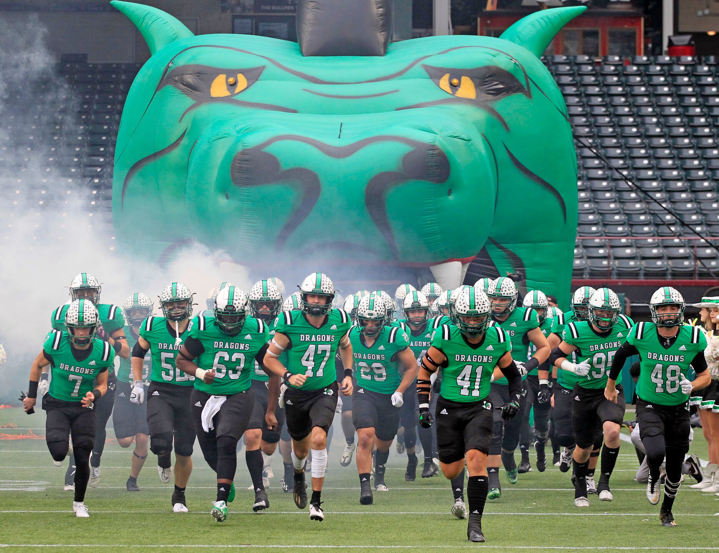 The Southlake high football teams enters the field prior to the start. Of the Class 6A...