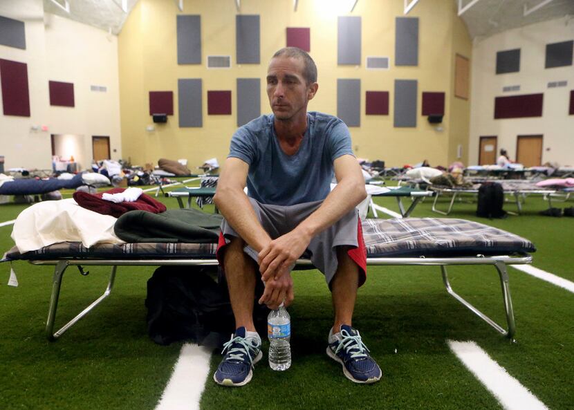 Kevin Sweet sits in his cot after taking shelter at a FEMA dome after Hurricane Harvey...