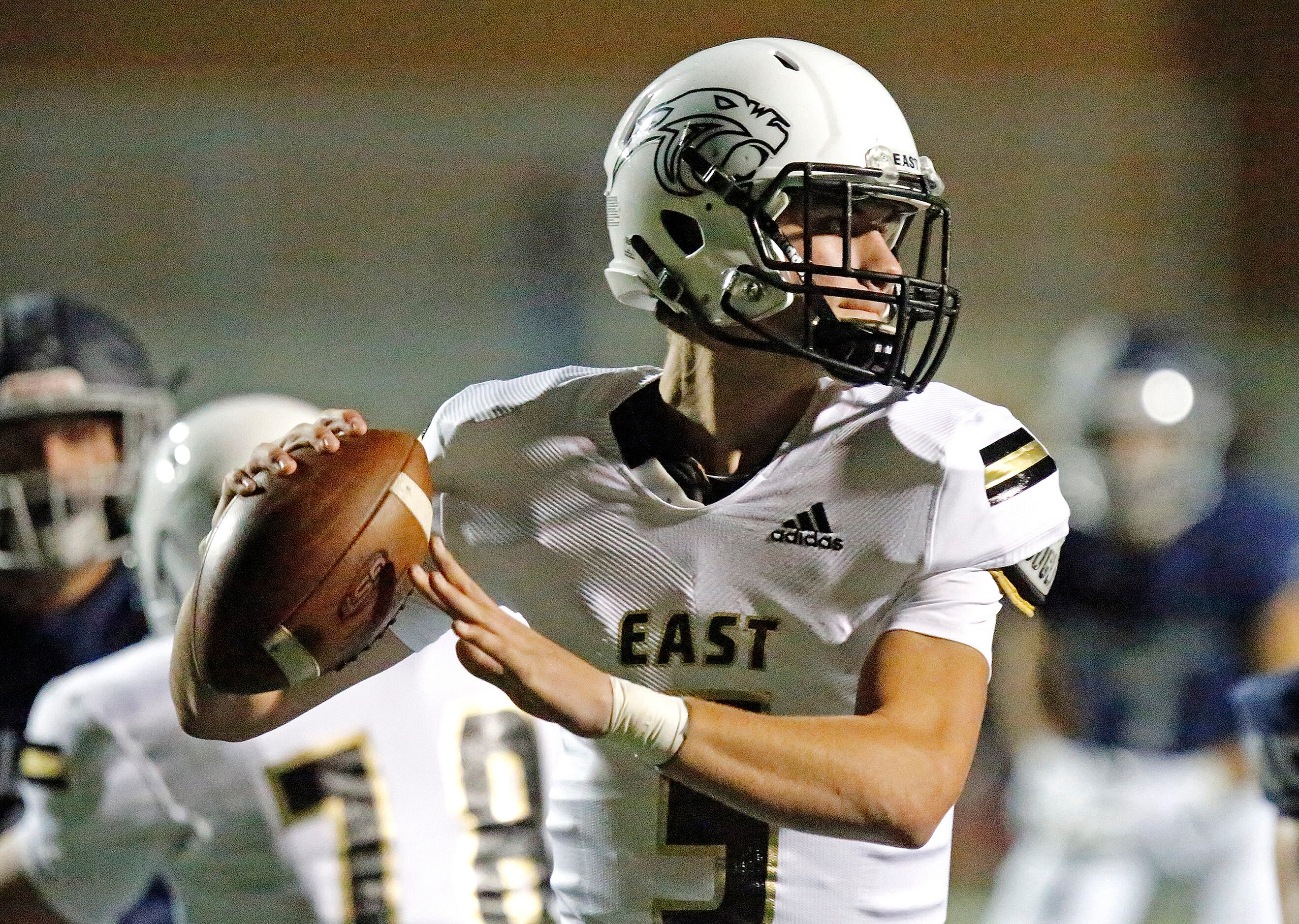 Plano East High School quarterback Drew Devillier (5) delivers a pass during the first half...