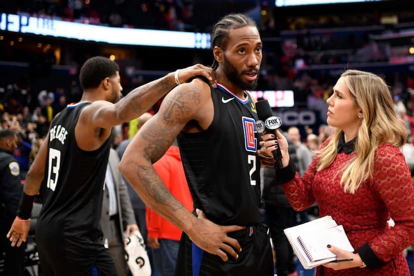 Los Angeles Clippers forward Kawhi Leonard (2) is interviewed by Jaime Maggio, right, after...