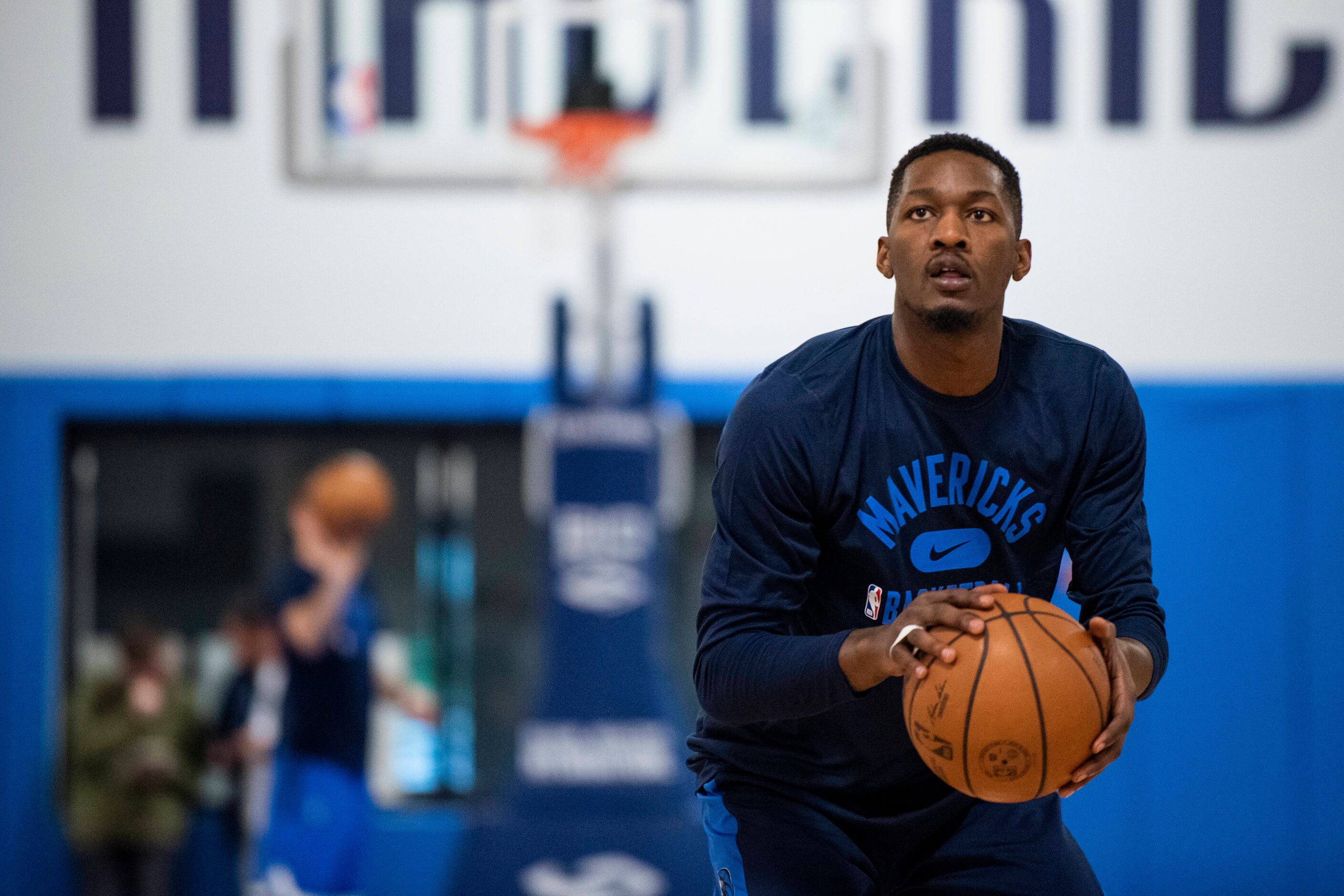 Dallas Mavericks power forward Dorian Finney-Smith (10) shoots a three-pointer while...