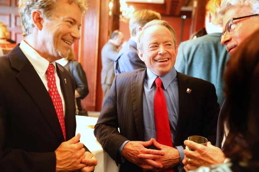 Sen. Rand Paul, (R-KY), left, and Texas Senate candidate Phillip Huffines mingle with the...