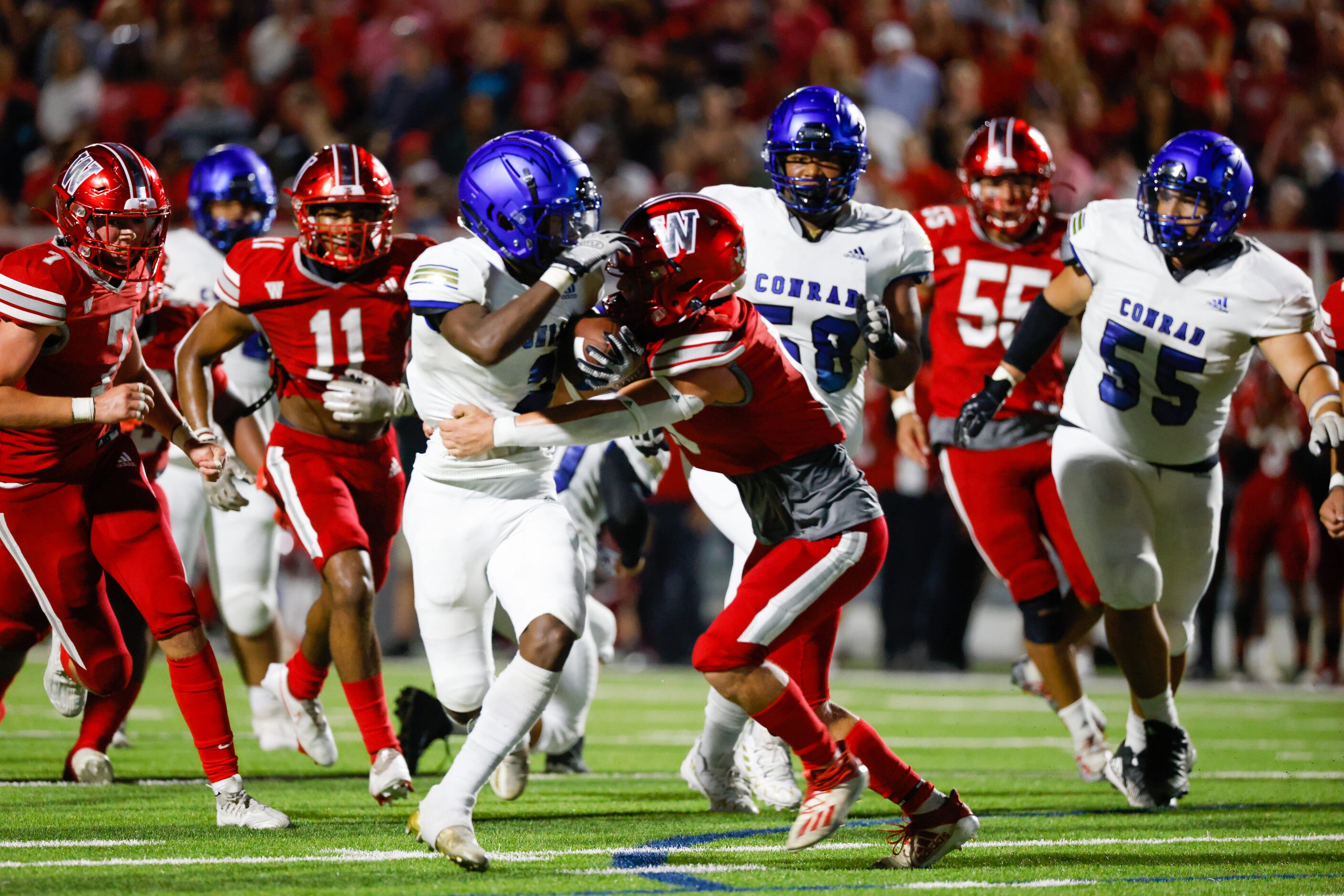 Conrad running back Carlos Walker (2) attempts to carry the ball to a first down during the...