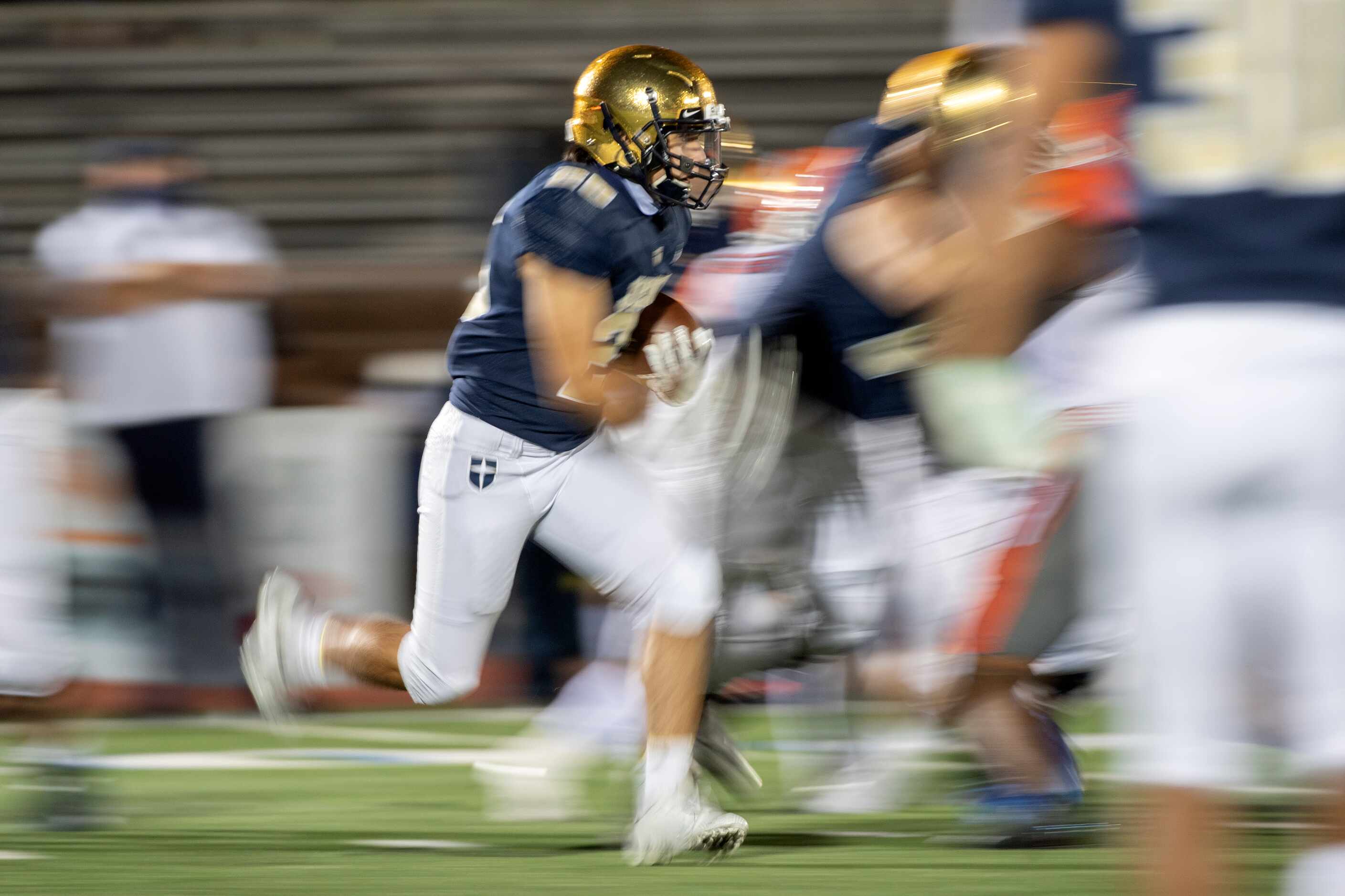 Jesuit senior running back Sam Morales carries the ball in the second half of a high school...