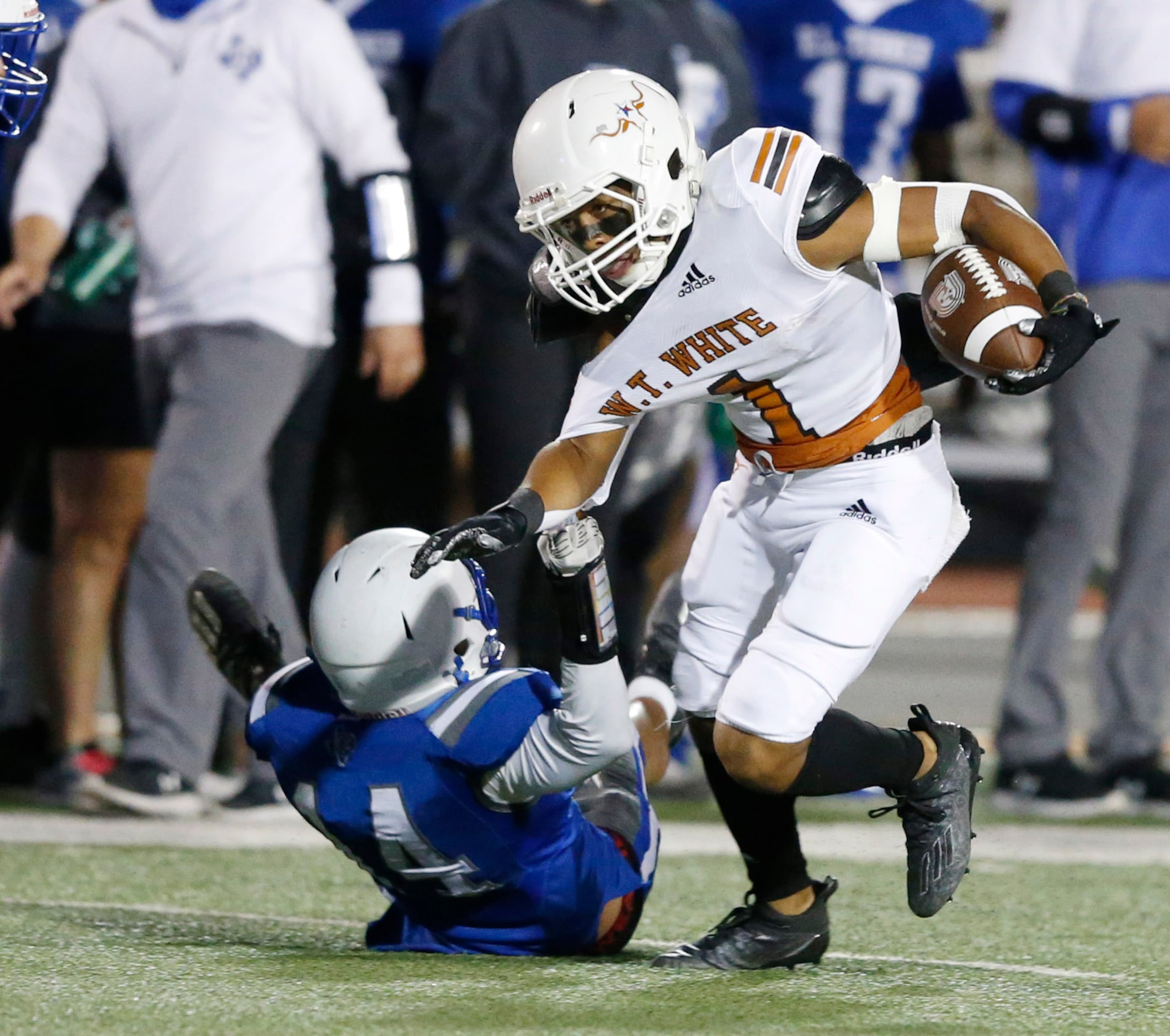 W.T. White's Dominik Dozal (1) attempts to break away from Carrollton R.L. Turner's Dylan...