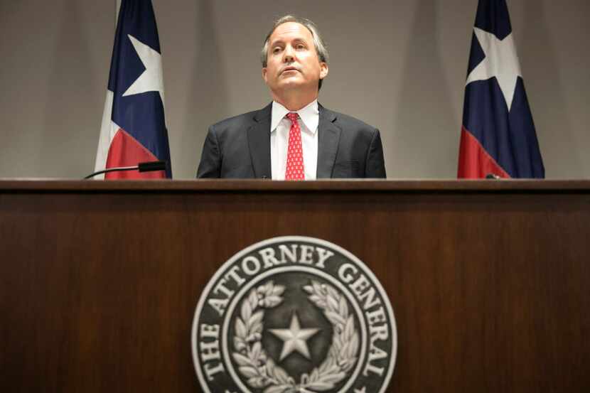 Texas Attorney General Ken Paxton, shown here at news conference in Austin, Texas, Wednesday...