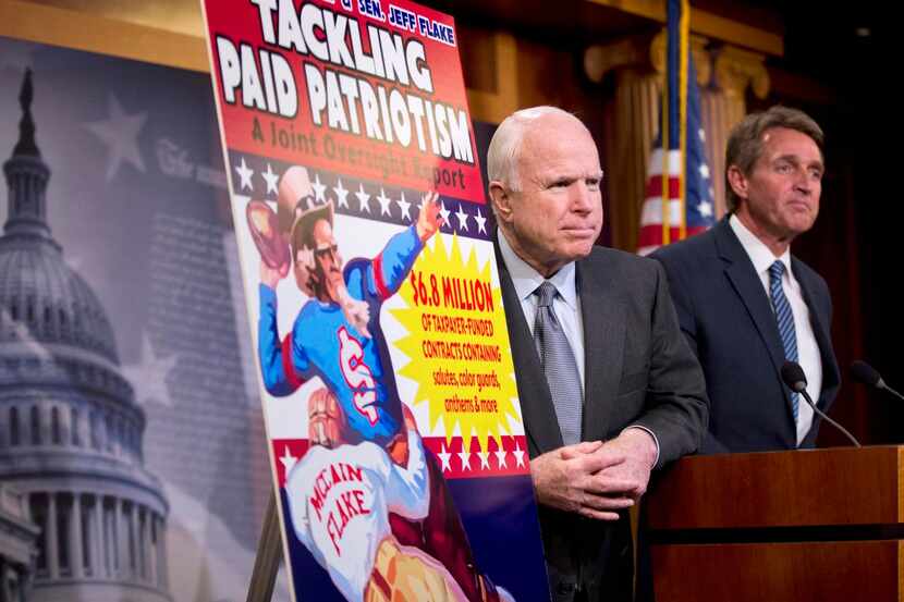 
Sen. John McCain, R-Ariz. (left) and Sen. Jeff Flake, R-Ariz., talk to reporters about paid...