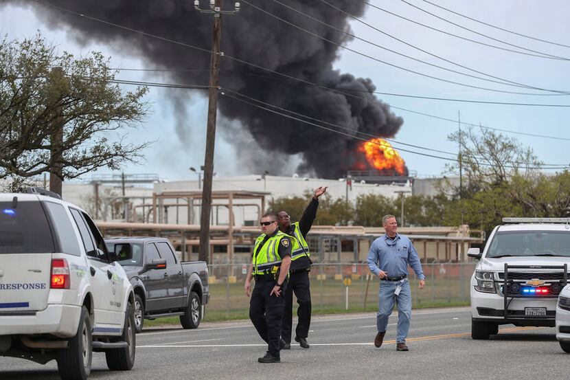 Smoke rises from a fire burning at the Intercontinental Terminals Company in Deer Park, east...