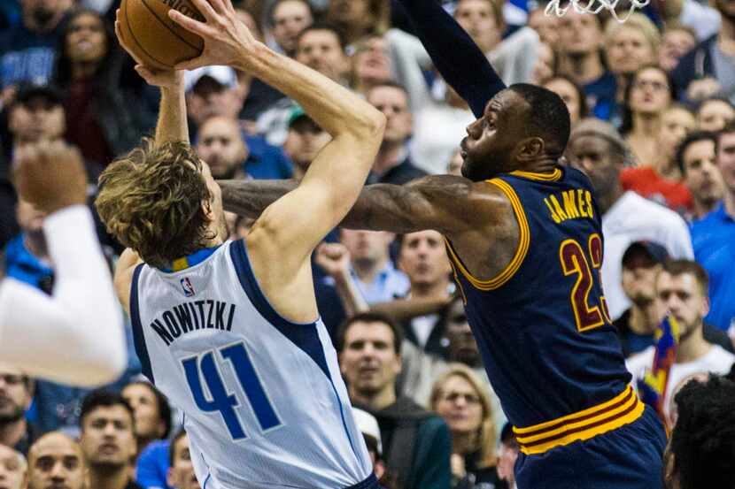 Dallas Mavericks forward Dirk Nowitzki (41) has his shot blocked by Cleveland Cavaliers...