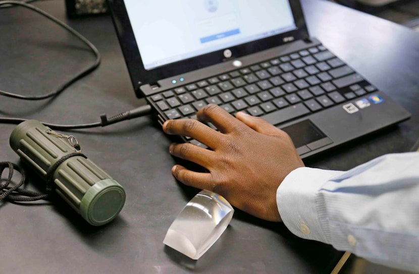 
A monocular and a magnifier sit at Lee Kamara’s desk during his seventh-grade science class...