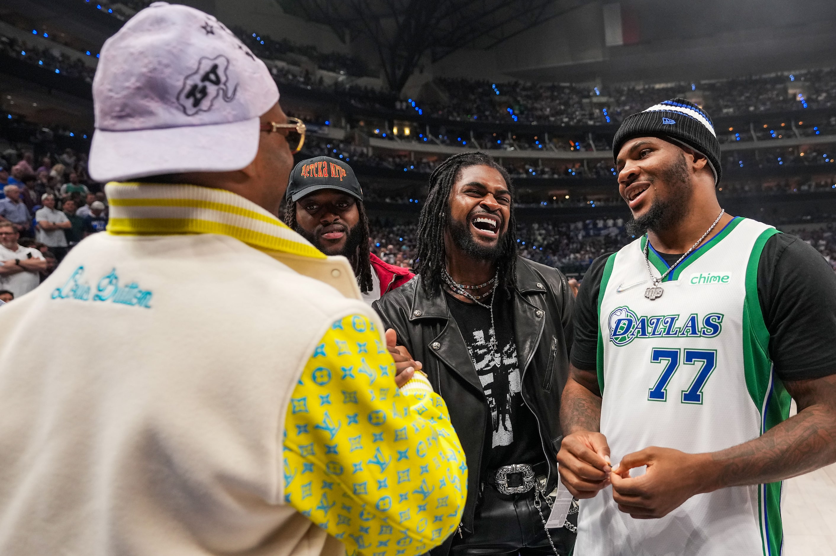 Dallas Cowboys players Michah Parsons (from right) Trevon Diggs and Osa Odighizuwa laugh...