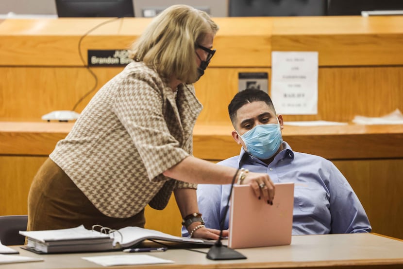 Armando Ricardo Navarro next to defense lawyer Robbie McClung as he waits to start his...