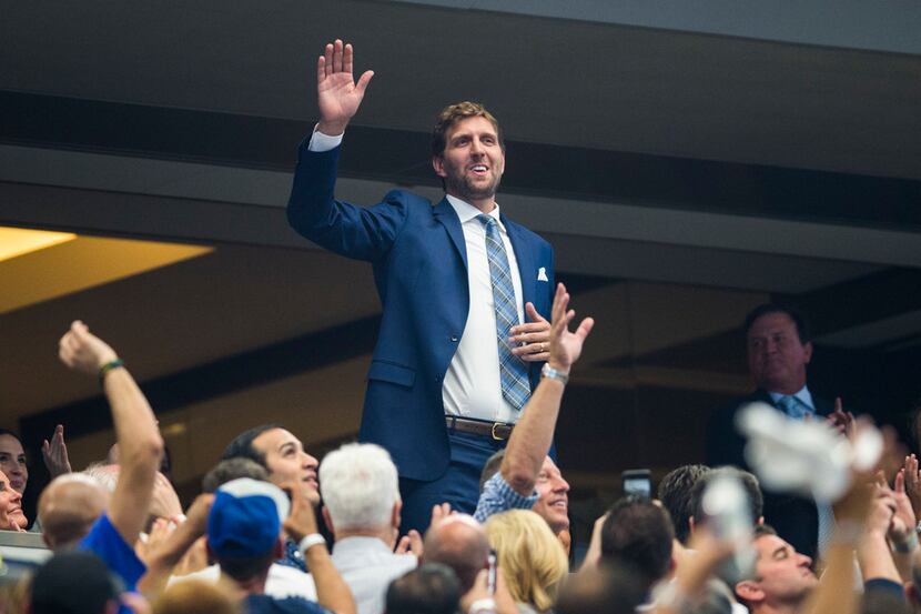 Former Dallas Mavericks player Dirk Nowitzki waves as he's introduced during the first...