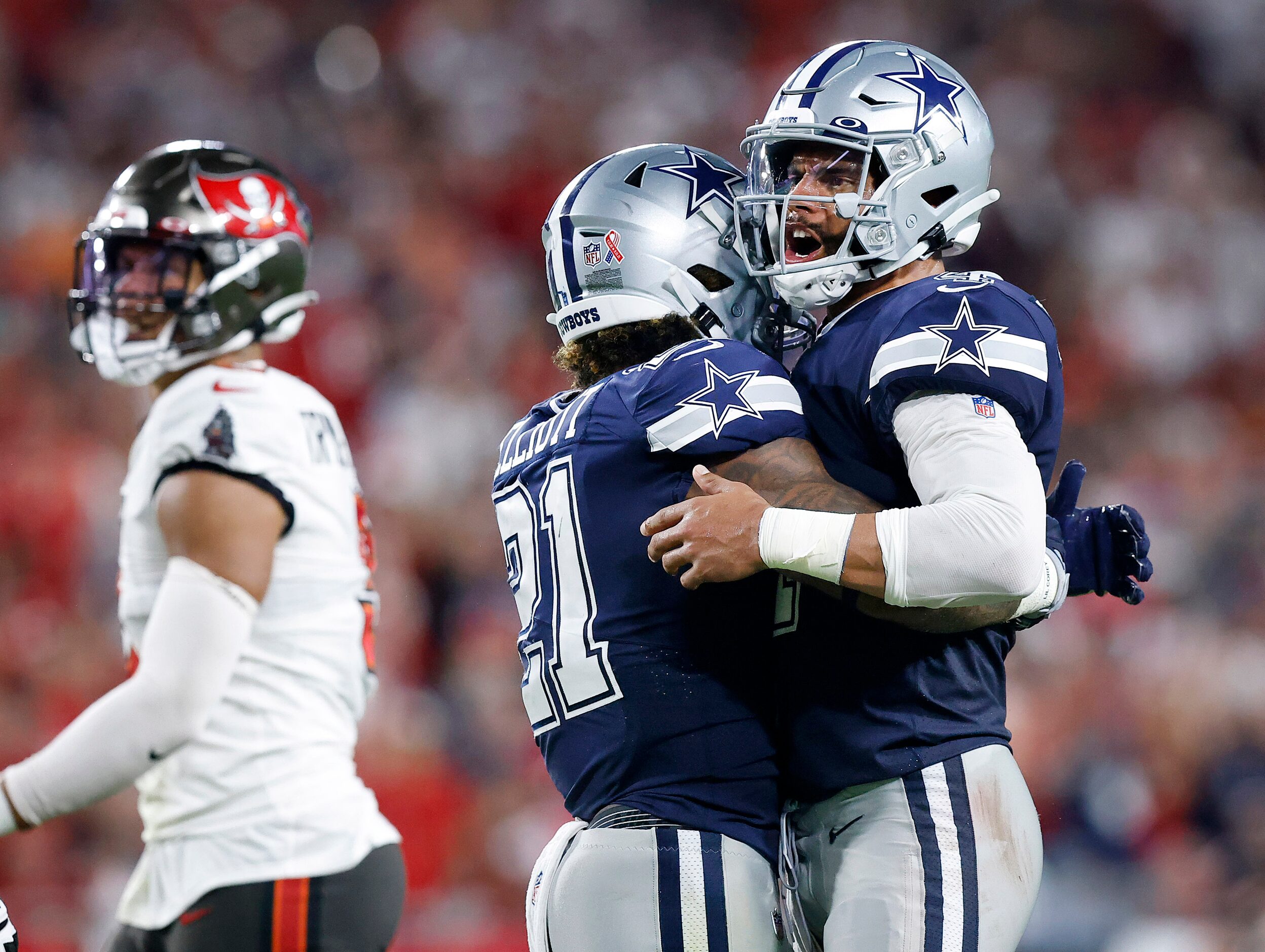 Dallas Cowboys quarterback Dak Prescott (4) and running back Ezekiel Elliott (21) celebrate...