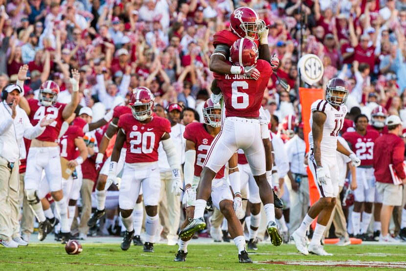 Alabama defensive back Marlon Humphrey (26) celebrates with defensive back Hootie Jones (6)...