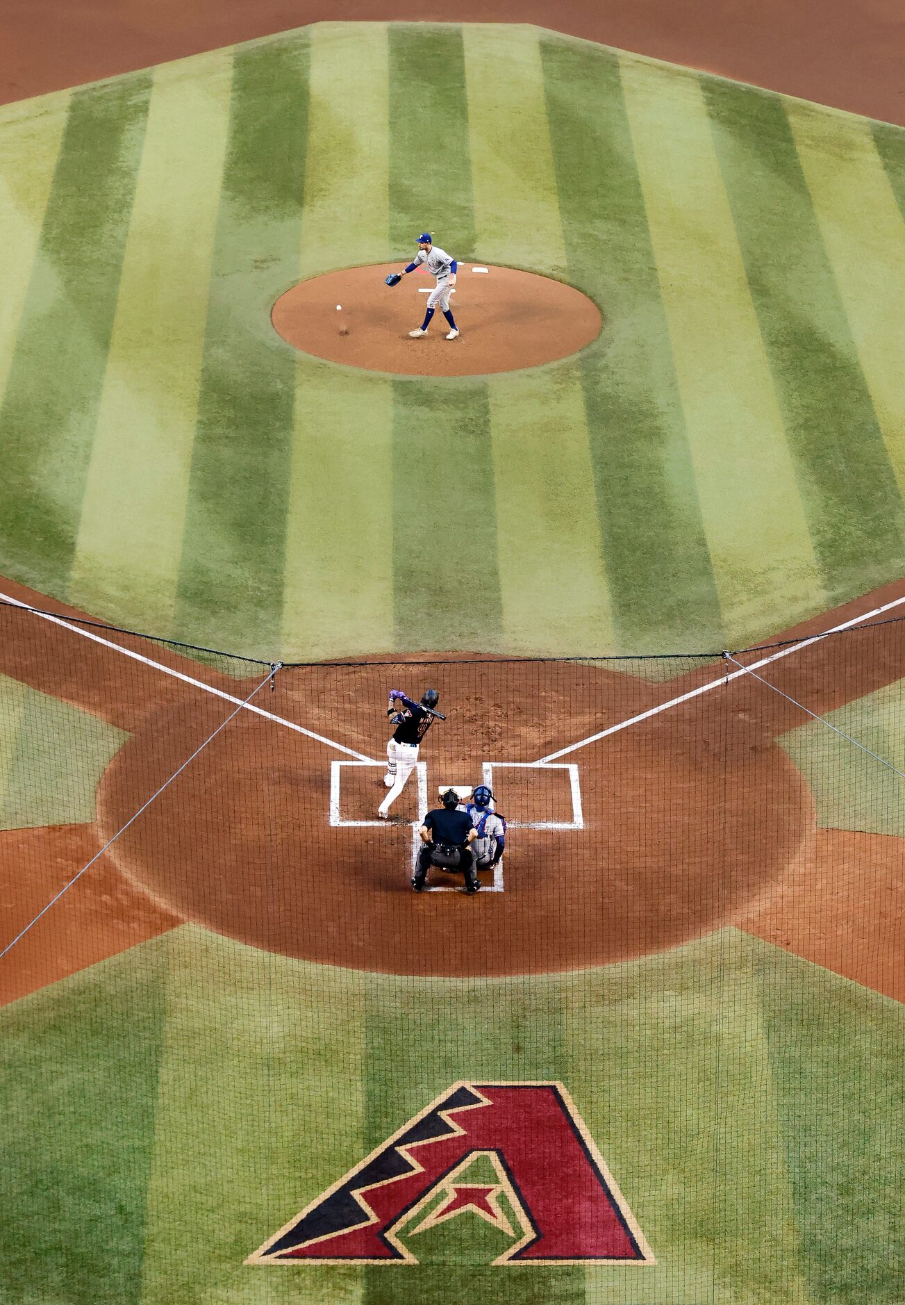 Arizona Diamondbacks second baseman Ketel Marte (4) lines a shot off the pitchers mound past...