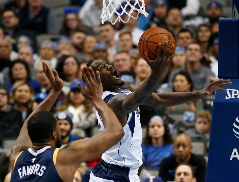 Dallas Mavericks forward Dorian Finney-Smith (10) attempts a layup as Utah Jazz forward...