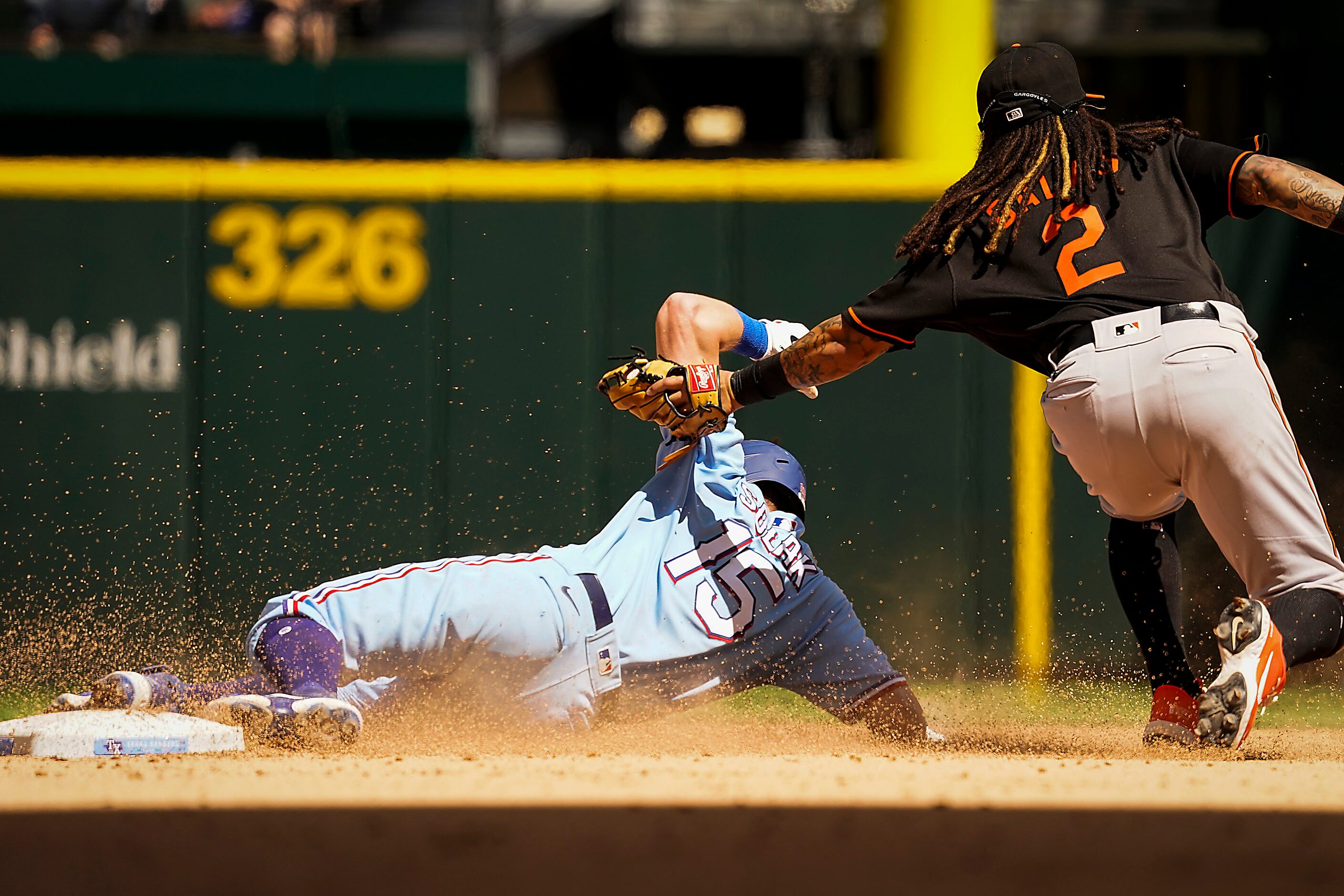 Texas Rangers second baseman Nick Solak is caught stealing at second base as Baltimore...