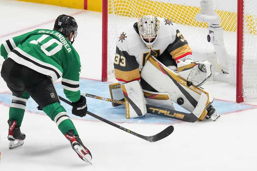 Vegas Golden Knights goaltender Adin Hill (33) turns away a shot from Dallas Stars center Ty...