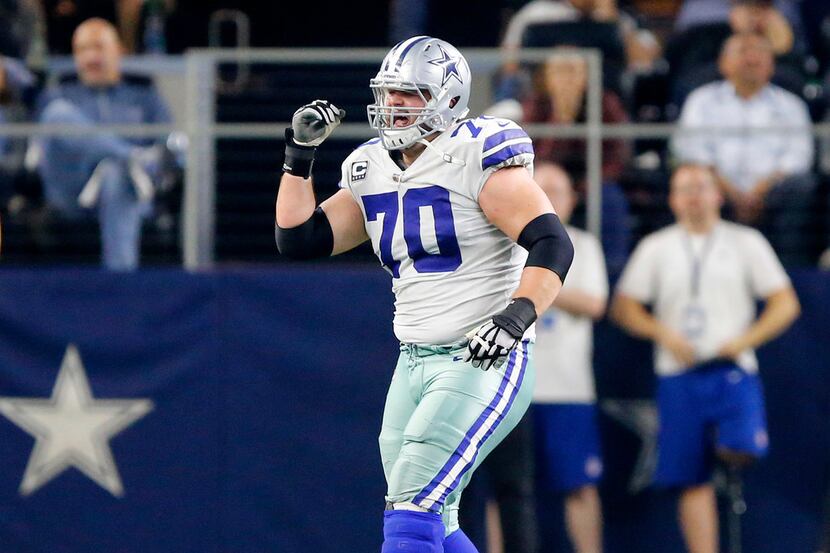 Dallas Cowboys offensive guard Zack Martin (70) tries to limp to the sideline before...