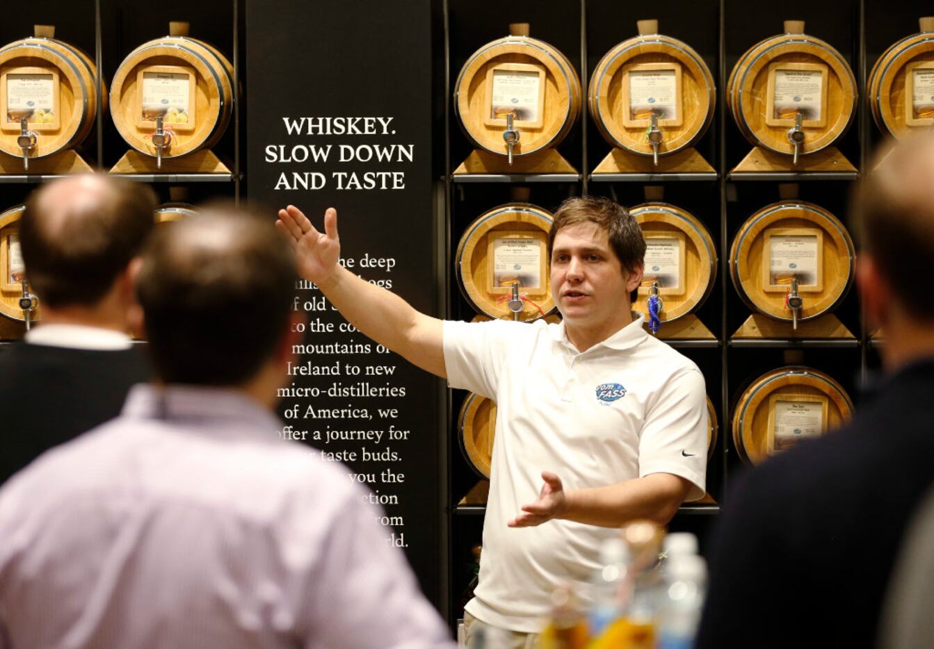Vom Fass' Ben Meinen, director of operations pulls whiskey for a customer during a whiskey...