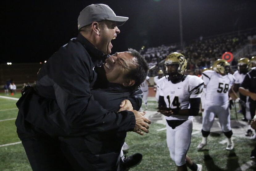 Plano East head coach Joey McCullough is lifted by offensive line coach Jacob Ramon in...