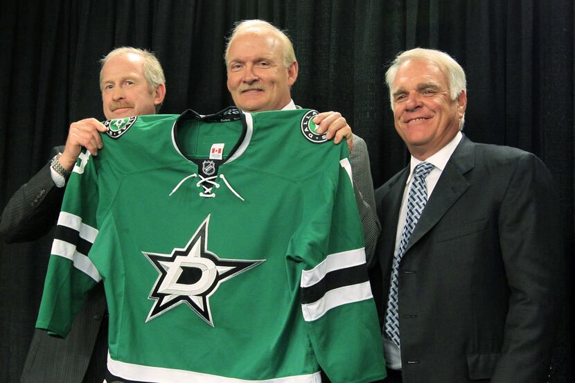 Stars general manager Jim Nill (left) and owner Jim Lites (right) introduce Lindy Ruff, who...