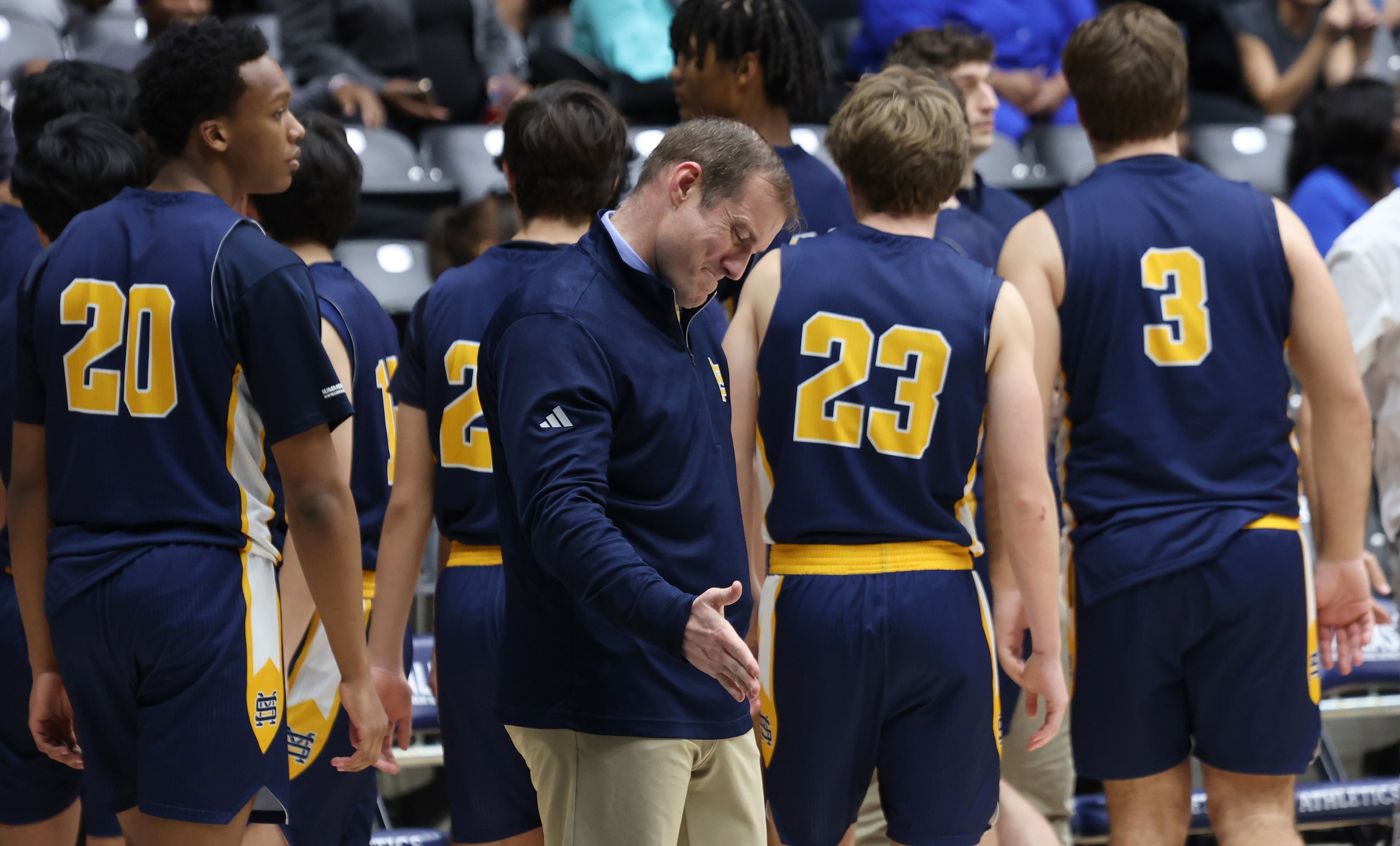 St. Mark's head coach Greg Guiler, center, reacts at the onset of a team timeout at the lack...