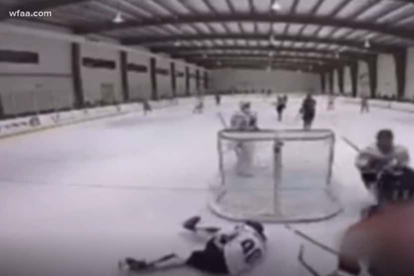 A screen capture of the video provided to WFAA of a hockey player striking an opponent with...