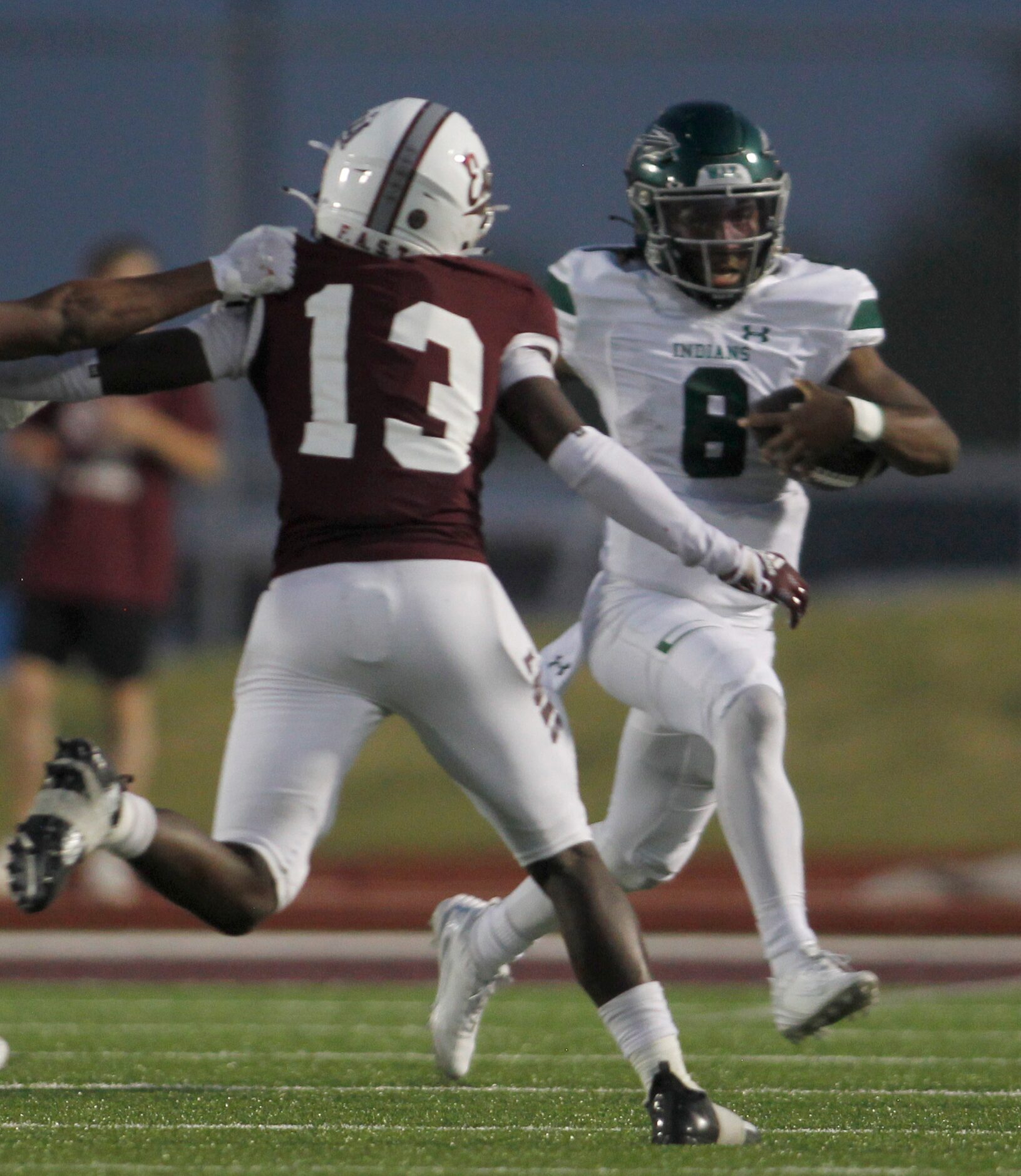 Waxahachie quarterback Ramon McKinney Jr. (8) bolts out of the backfield as Ennis defensive...