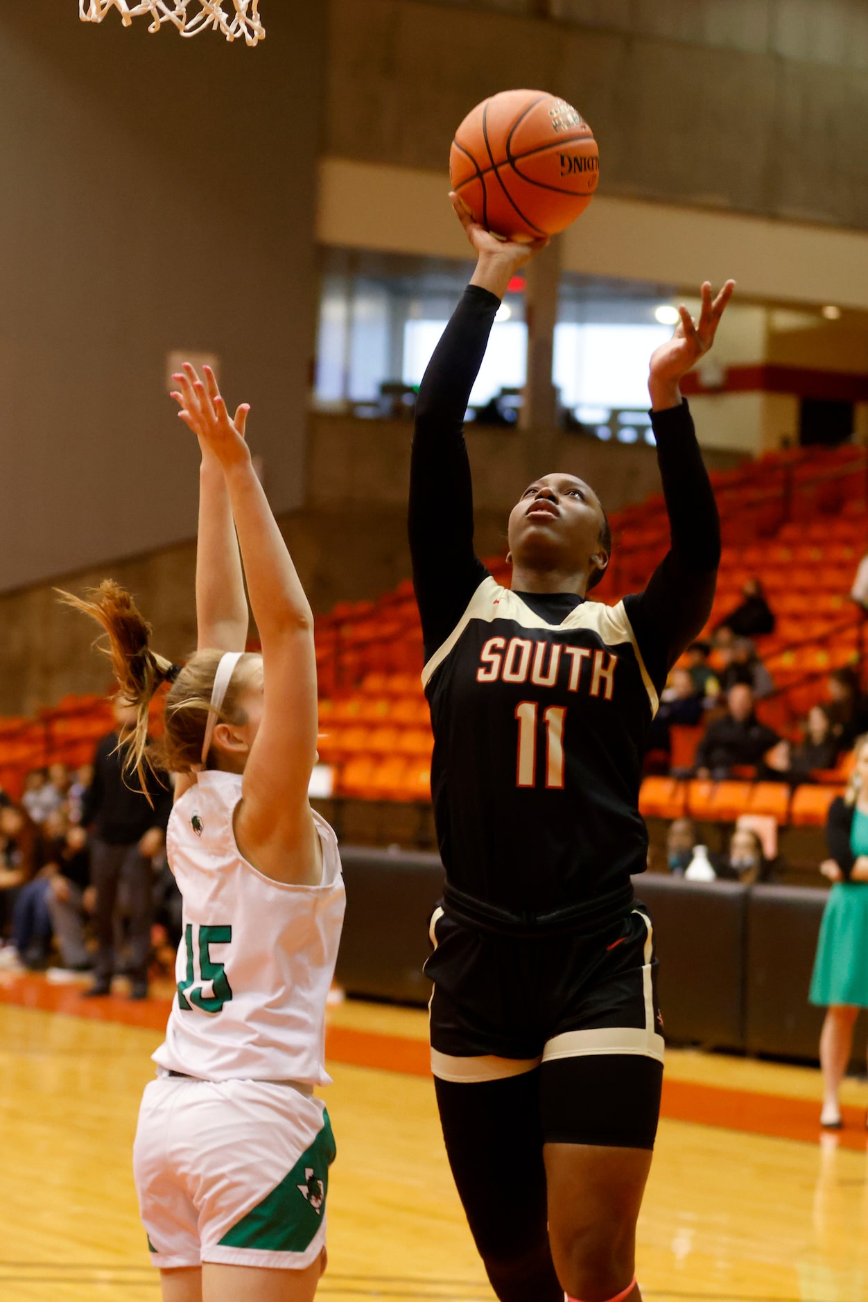 South Grand Prairie’s Jahcelyn Hartfield (11) makes a basket in front of Southlake’s Emily...