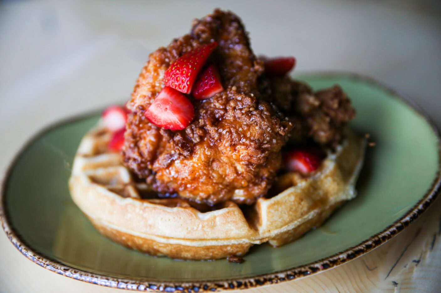 Chicken 'N Waffles is seen at Punch Bowl Social on Thursday, June 27, 2019 in Dallas. (Ryan...