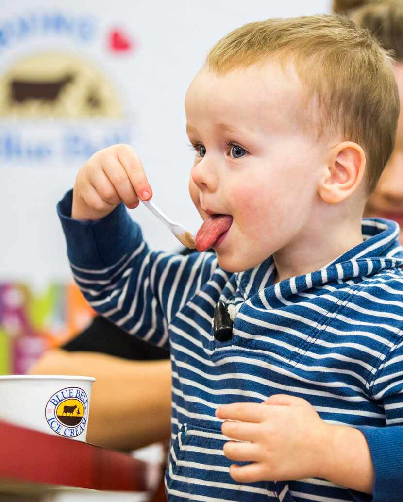 
Ian Jones, 2, enjoyed a free scoop of Blue Bell on Monday at Big State Fountain Grill in...