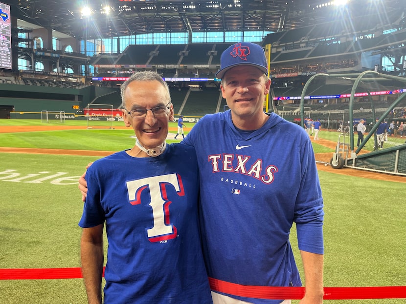 Mike Lotief, president and CEO of Swing Attractors, poses with Tim Hyers, hitting coach of...