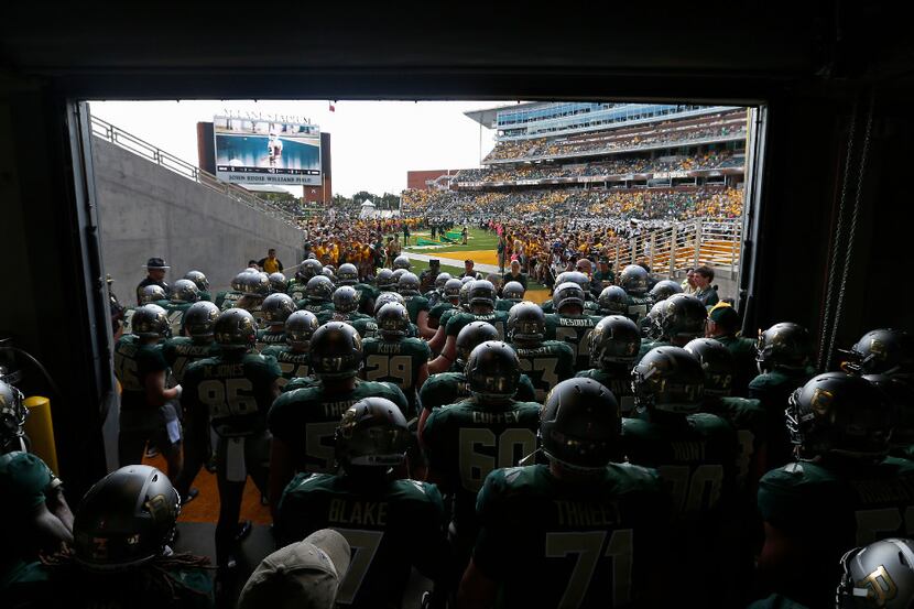 Baylor players get ready to take the field against Kansas at McLane Stadium in Waco, Texas,...
