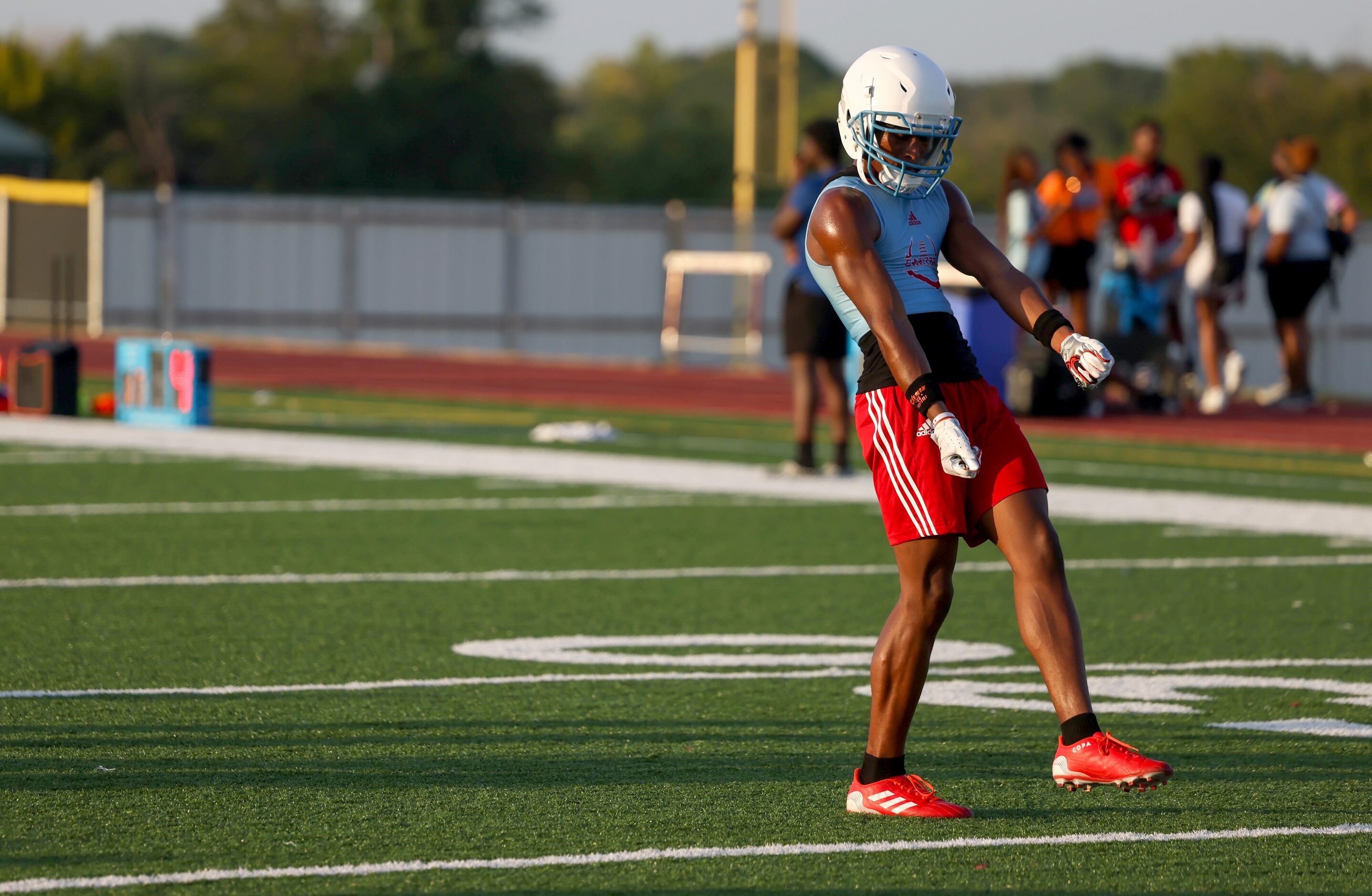 O’Ryan Wallace dances to the music playing on the field before preparing for a drill at the...