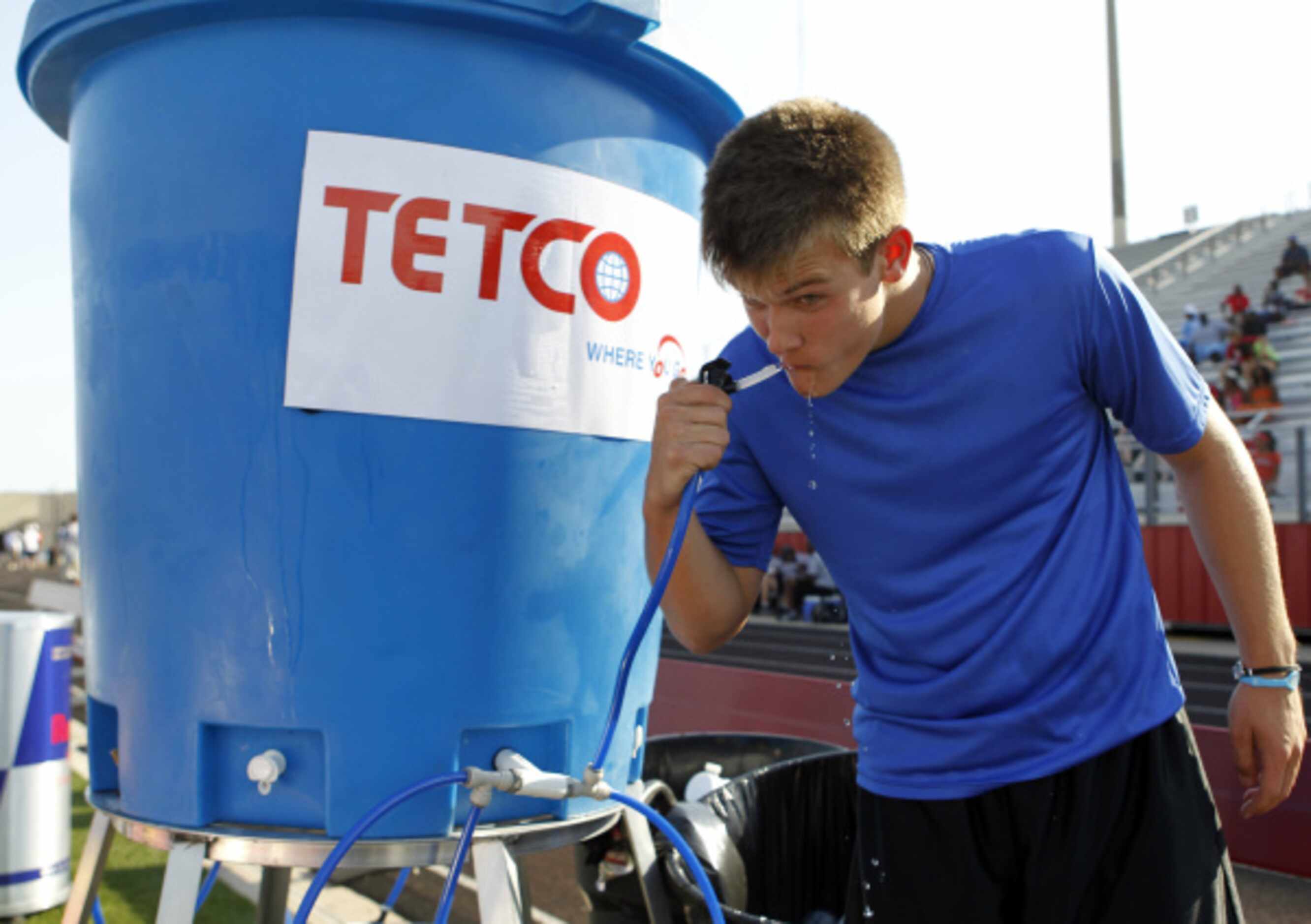 Hebron's Carson Proffitt (17) gets a drink of water during the Red Bull Game Breakers 7 on 7...