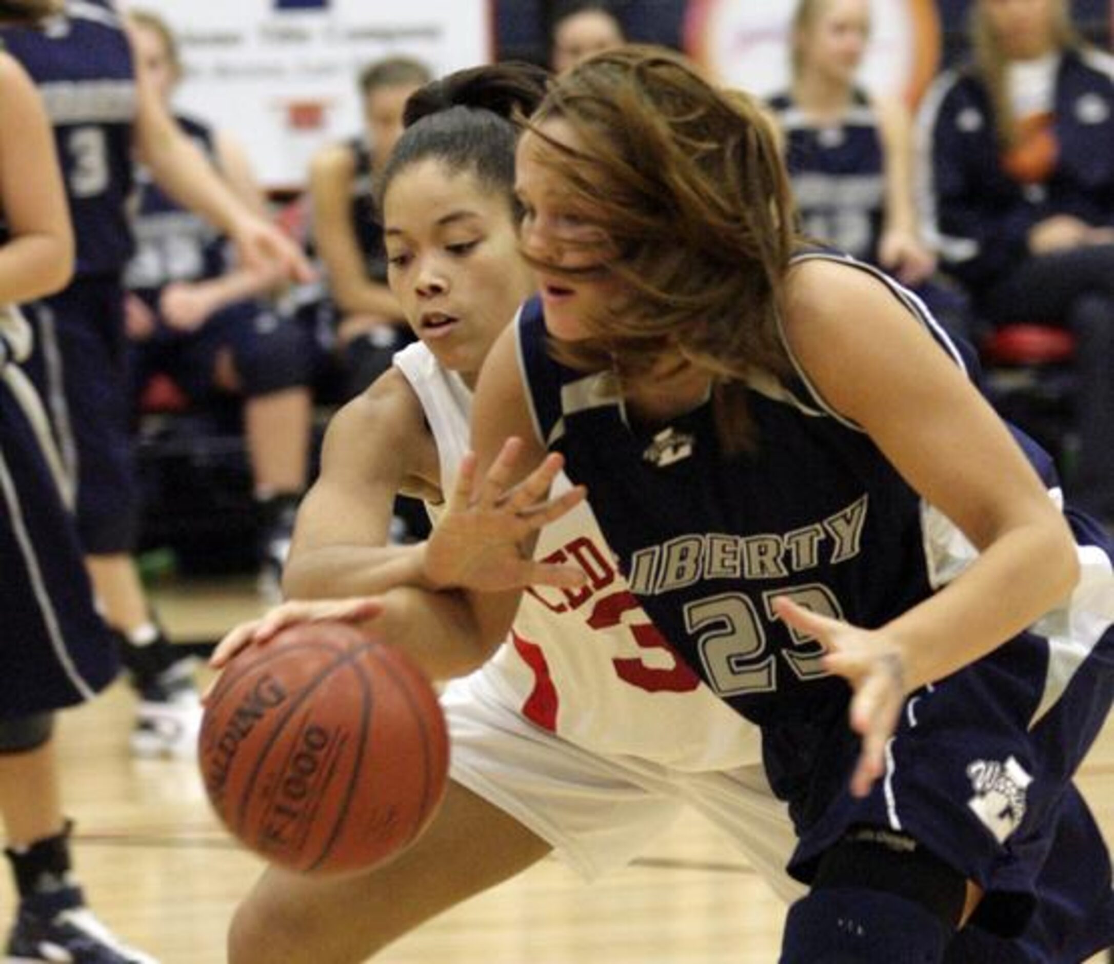 Cedar Hill junior forward Ariel Robertson reaches in to deflect the ball from Argyle Liberty...