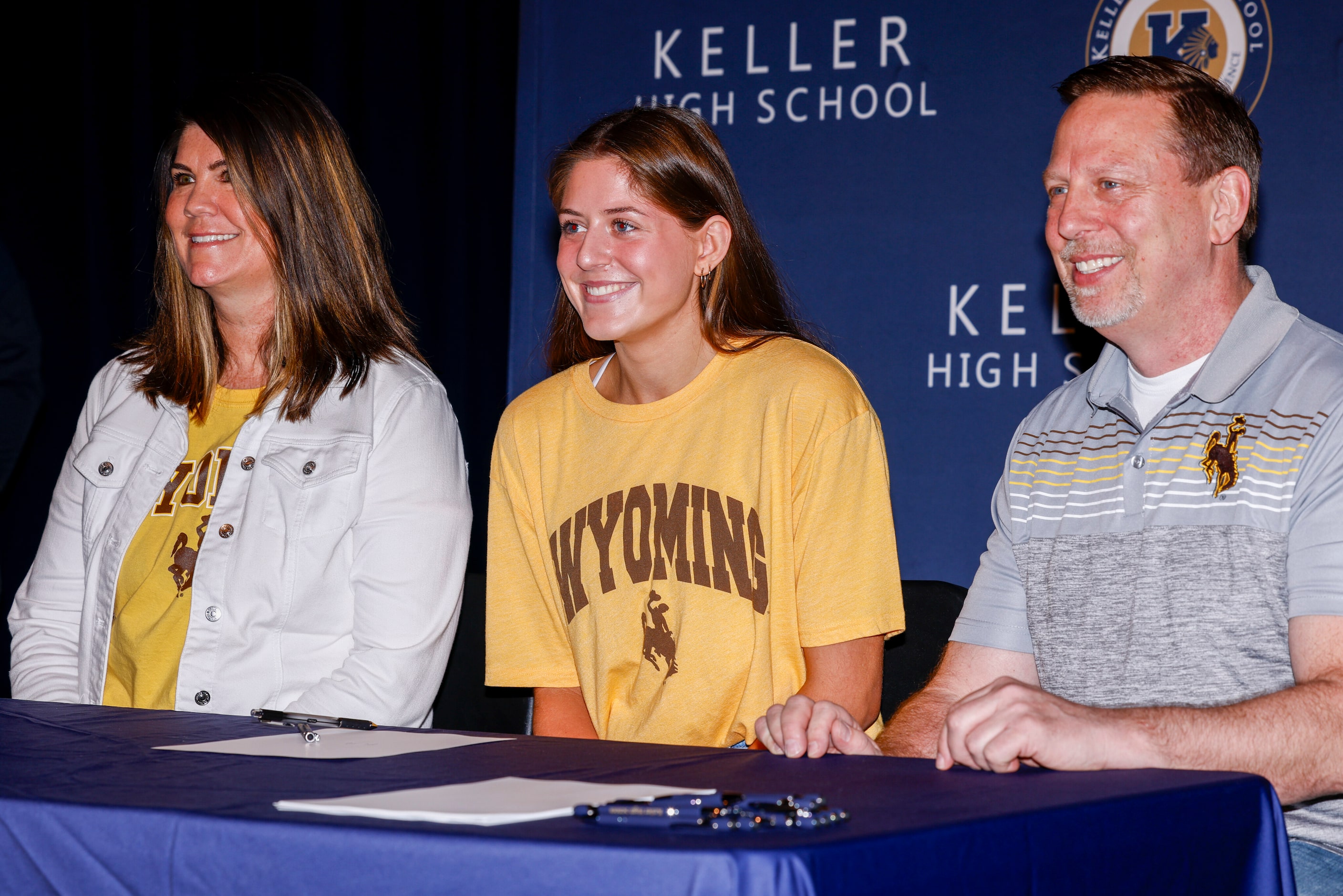 Keller volleyball player Reagan Sharp poses for a photo with her parents Jennifer Sharp...