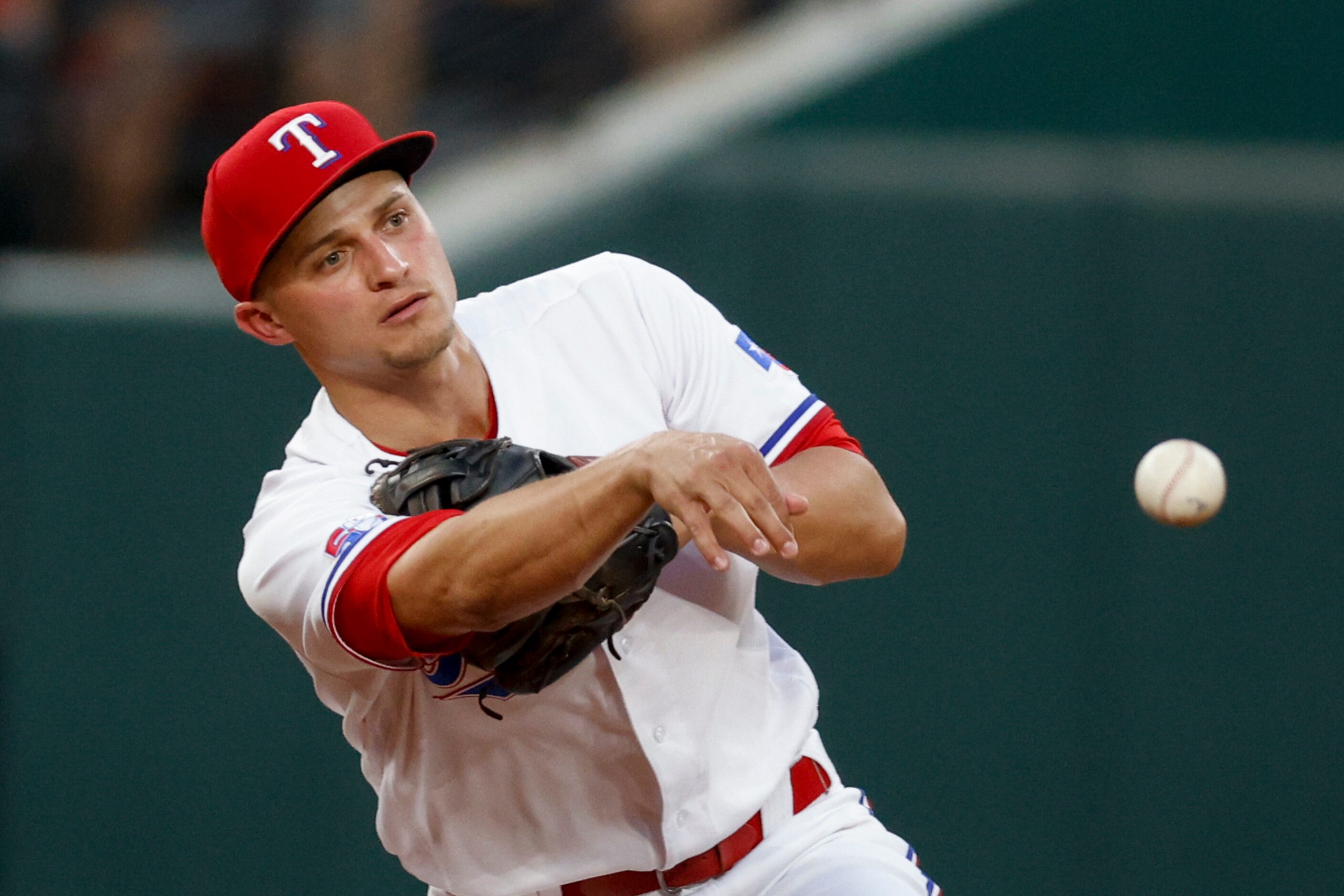 Texas Rangers shortstop Corey Seager (5) throws the ball to turn a double play during the...