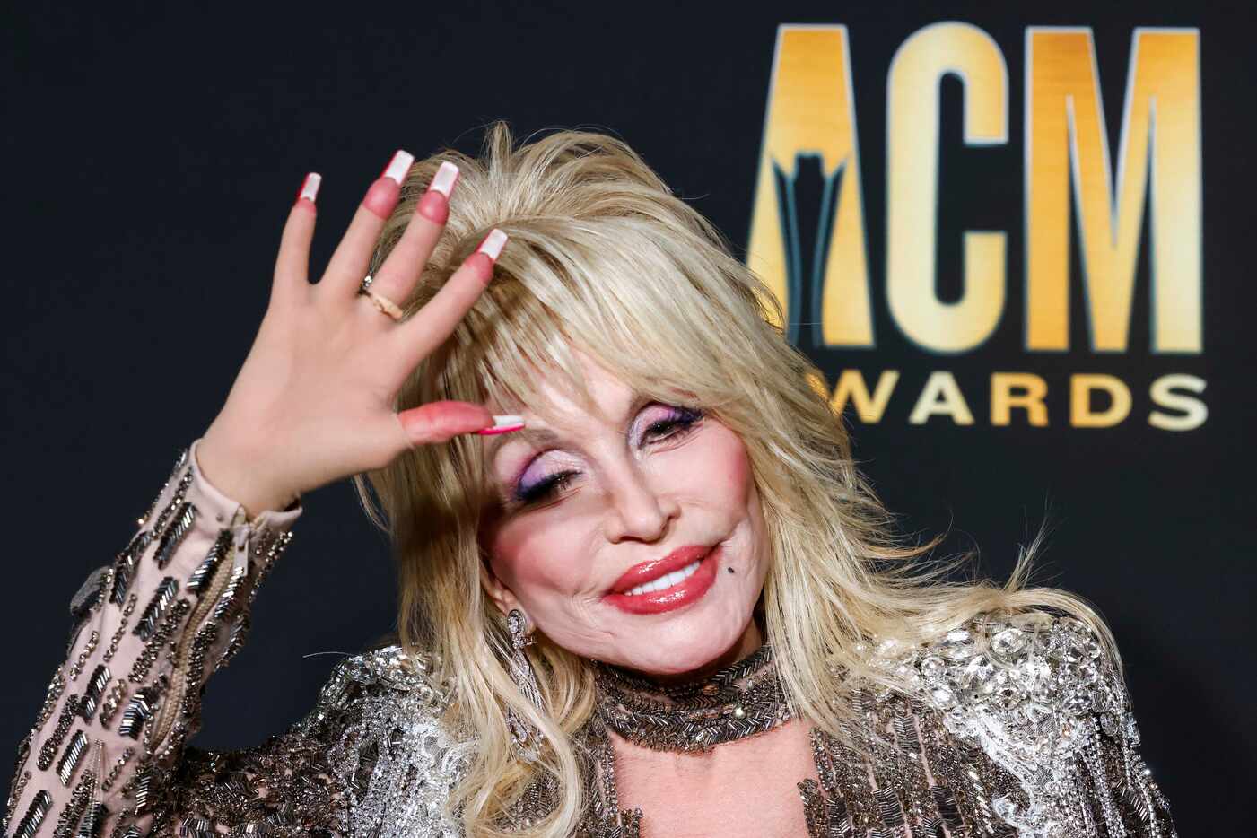 Dolly Parton arrives for the red carpet during the 58th Academy of Country Music Awards on...