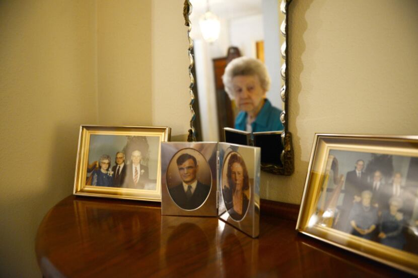 Opal Joplin, 100, is reflected in a mirror that her husband Cecil gave her shortly after...
