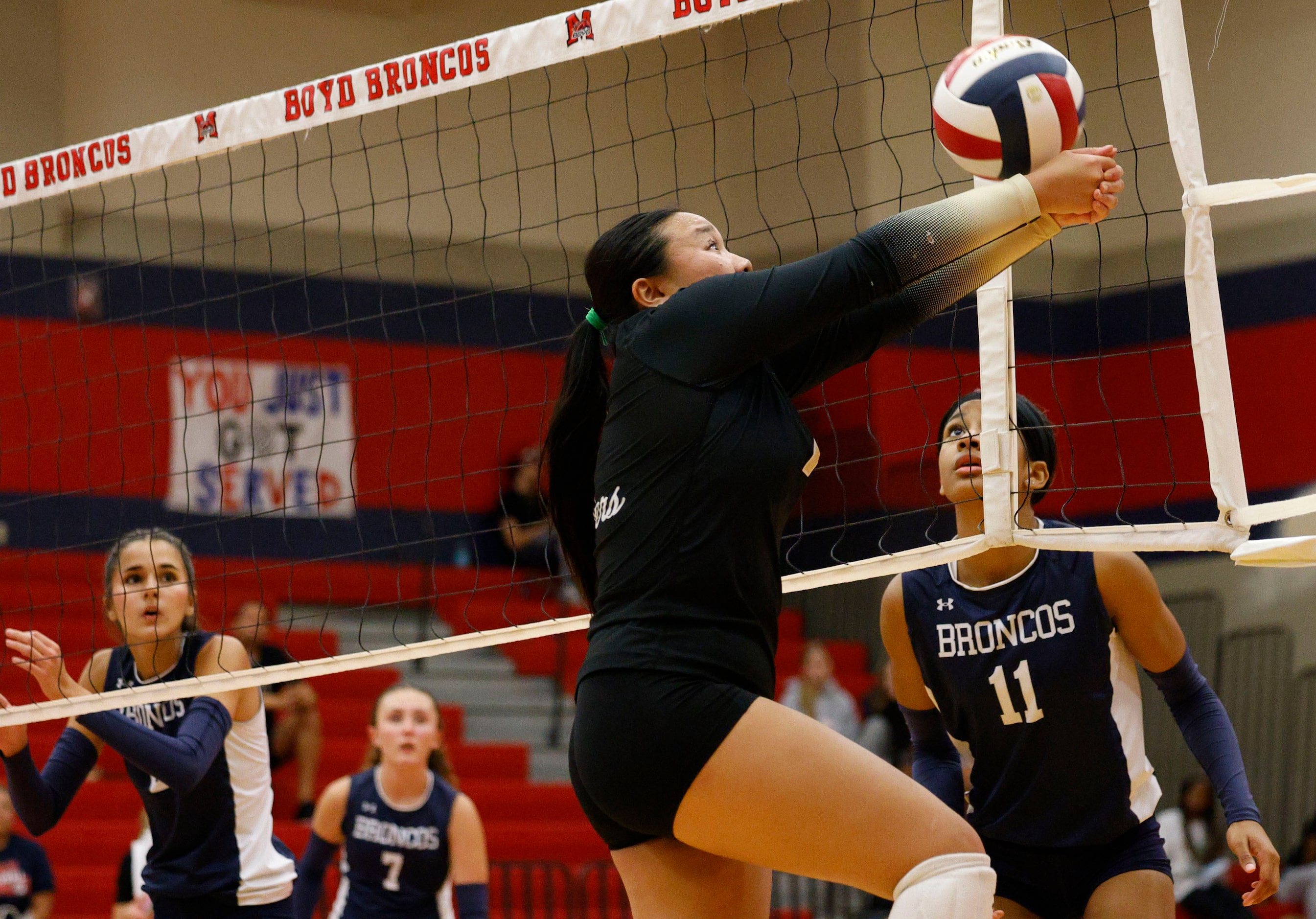 Plano East's Megan Nguyen (1) tries for a save against McKinney Boyd in the second set...